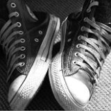 Worn Black High Top Chucks  Angled front and top view of black high top chucks.