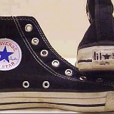 Worn Black High Top Chucks  Worn black high tops without laces, inside patch and heel patch views.