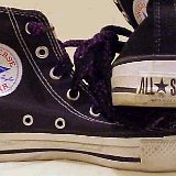 Worn Black High Top Chucks  Worn black high tops with hiking laces, inside patch and heel patch views.