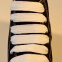 Extra Fat Shoelaces on High Top Chucks  Black high top with white extra fat shoelaces.