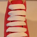 Extra Fat Shoelaces on High Top Chucks  Red high top with white extra fat shoelaces.