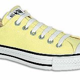 Yellow Chucks  Angled side view of a pale yellow right low cut chuck.