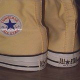 Yellow Chucks  Partial rear and inside patch views of vintage yellow high top chucks.