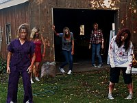 Zombies Wearing Chucks  A group of zombies stumbling out of an abandoned shed.